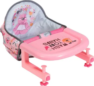 A pink doll high chair with a tray and a patterned fabric seat.