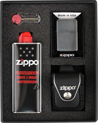 A Zippo gift set is presented in a black foam-lined box, containing a lighter, fuel, and a leather case.