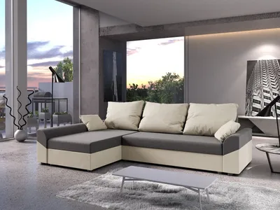A modern living room with a large sectional sofa, large windows showing a sunset view, and contemporary decor.