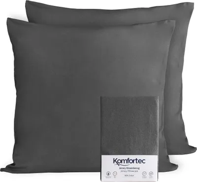 Two dark gray pillowcases are shown, with one folded and placed in front of the other. A small white box with product information is also visible.