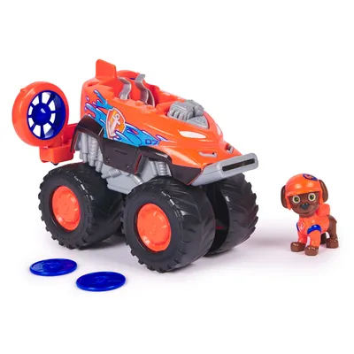 A toy monster truck and a toy dog figure are displayed on a white background.
