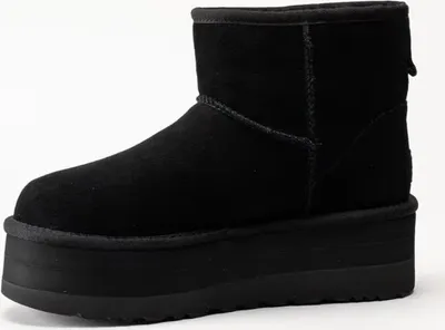 A black UGG Classic Mini Platform boot is shown against a white background.