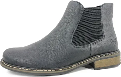 A side view of a black Chelsea boot.