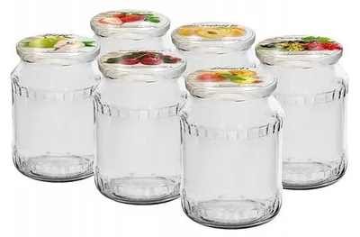 Six clear glass jars with decorative lids featuring fruit illustrations, arranged in two rows.