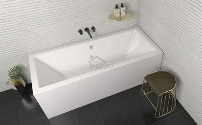 A modern bathroom with a white bathtub, black fixtures, and a small stool.