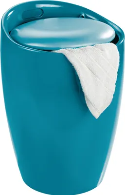 A teal colored stool with a white towel draped over the side.