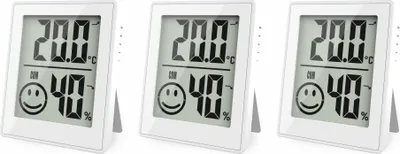 Three white digital thermo-hygrometers are displayed side-by-side on a white background.