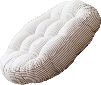 A round, tufted cushion with a striped pattern.