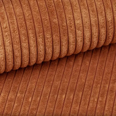 A close-up view of brown corduroy fabric.