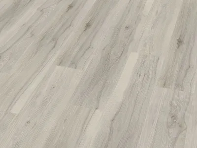 A close-up view of a light gray wood-look vinyl flooring.