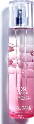 A close-up studio shot of a Caudalie Rose Vigne Eau Fraiche bottle.