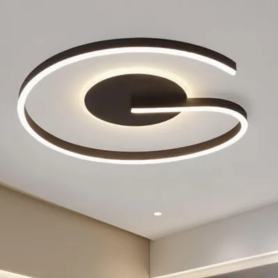 A modern LED ceiling light fixture with a unique, curved design, mounted on a white ceiling.