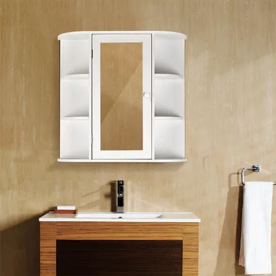 A white bathroom cabinet with a mirrored door is mounted above a sink and vanity.