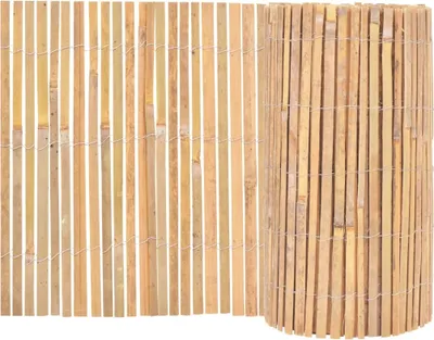 A close-up view of a rolled-up bamboo fence and a section of an unrolled fence against a white background.