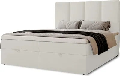 A white boxspring bed with two storage drawers and a padded headboard, shown against a white background.