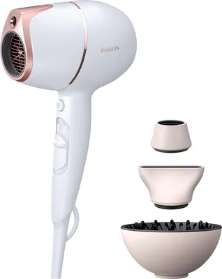 A white Philips hair dryer with rose gold accents and three attachments (diffuser, concentrator nozzle, and a smaller nozzle) are displayed against a white background.