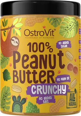 A jar of OstroVit 100% Peanut Butter with cartoon illustrations of a sloth, peanuts, and tropical leaves.
