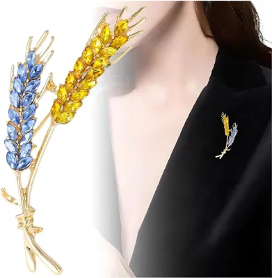 Immagine prodotto di Spilla Camerazar con zirconi blu a forma di fiocco di grano, placcata oro