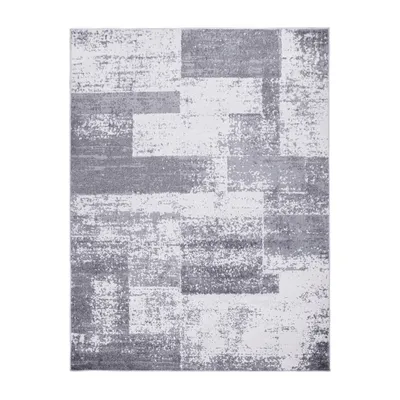 A rectangular rug with a geometric pattern is shown from a top-down view against a white background.