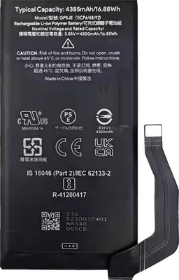 A black battery with a flexible cable attached, lying on a white background.