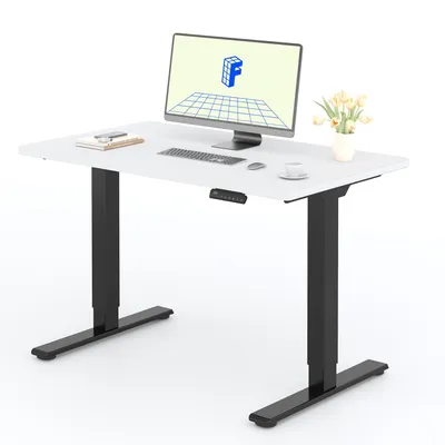 A modern standing desk with a computer and accessories on its surface, set against a white background.