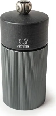 A close-up studio shot of a Peugeot pepper mill.