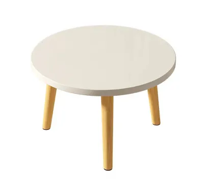 A white round coffee table with three wooden legs, isolated on a white background.