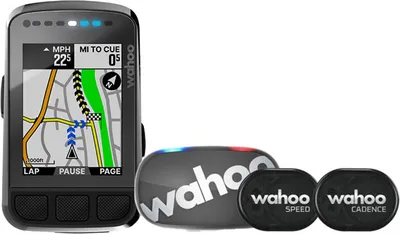 A Wahoo ELEMNT BOLT V2 GPS cycling computer with two sensors (speed and cadence) are displayed on a white background.