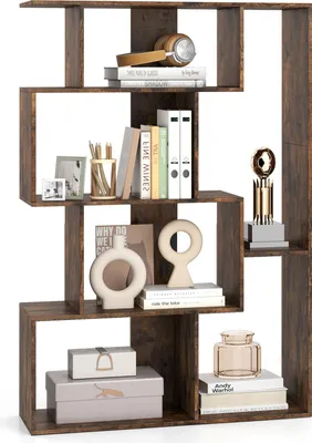 A wooden geometric bookshelf filled with various decorative items and books.