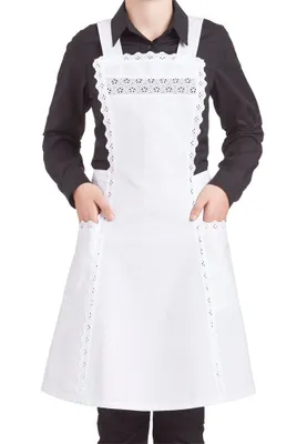 A person wearing a black shirt and a white apron with lace trim.