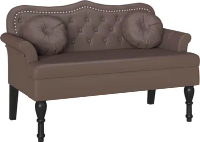 A brown Chesterfield sofa with two round cushions and decorative studs along the top edge, presented on a white background.