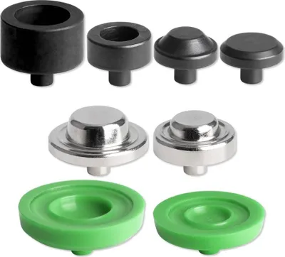 A collection of different sized eyelet setting tools and dies.