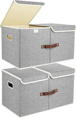 Two stacks of grey fabric storage boxes with beige interiors and brown handles, one stack with the lid open.