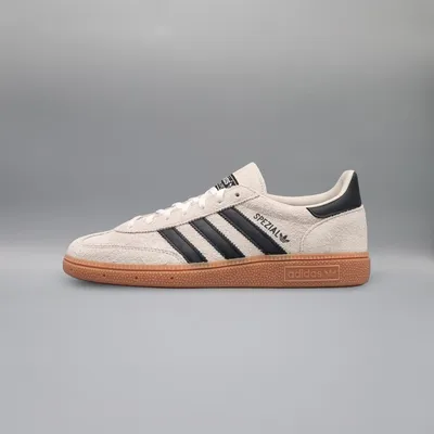 A side view of an Adidas Handball Spezial shoe against a plain gray background.