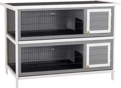 A two-tiered rabbit hutch is shown against a white background.