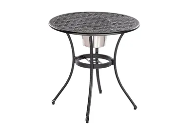 A round outdoor table with a metal lattice top and a central cooler or ice bucket holder.