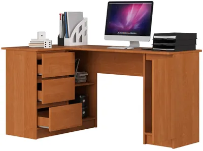 A corner desk with a computer, office supplies, and storage drawers.