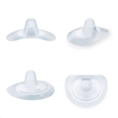 Four views of NUK breast shells on a white background.