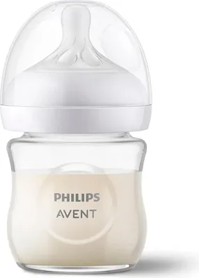 A Philips Avent baby bottle filled with milk, shown against a white background.