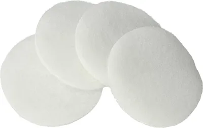 A group of white, round filter pads.