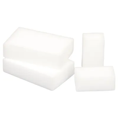 Four white rectangular sponges are arranged in two groups on a white background.