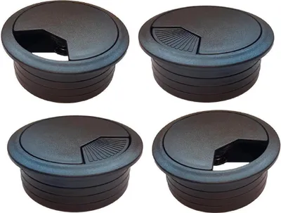 Four black cable grommets are arranged in a 2x2 grid against a white background.