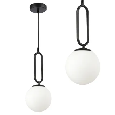 Two black pendant lights with white opal glass globes are shown against a white background.