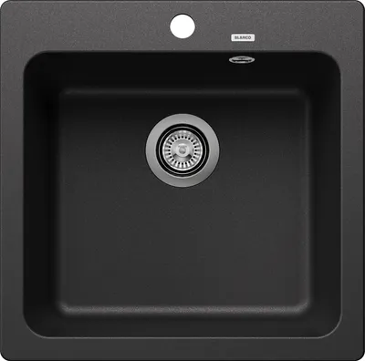 A top-down view of a black kitchen sink with a silver drain.