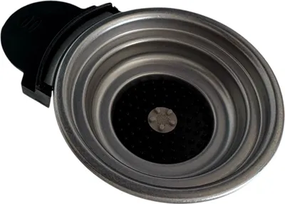 A close-up, overhead shot of a coffee machine portafilter.