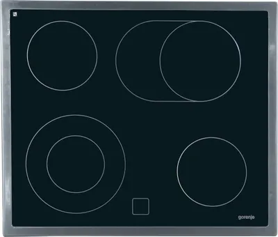 A top-down view of a black electric stovetop with silver trim.