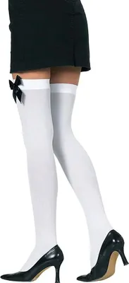 A person's legs wearing white thigh-high stockings with black bows and black high heels.