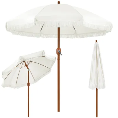 Three views of a white patio umbrella with fringe, one open and angled, one open and straight on, and one closed.