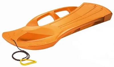An orange plastic sled with a rope and handle, isolated on a white background.