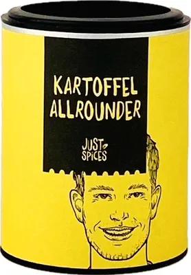 A yellow cylindrical container of spices with a black label featuring text and a drawing of a man's face.